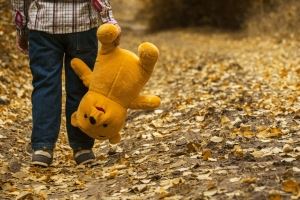 Image of a child walking while carrying a stuffed animal, representing the announcement of a new NJ child relocation standard in an article by an experienced Monmouth County divorce attorney